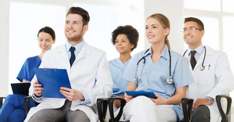 group of happy doctors on seminar at hospital