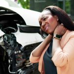 Middle aged woman suffering neck pain after a car accident