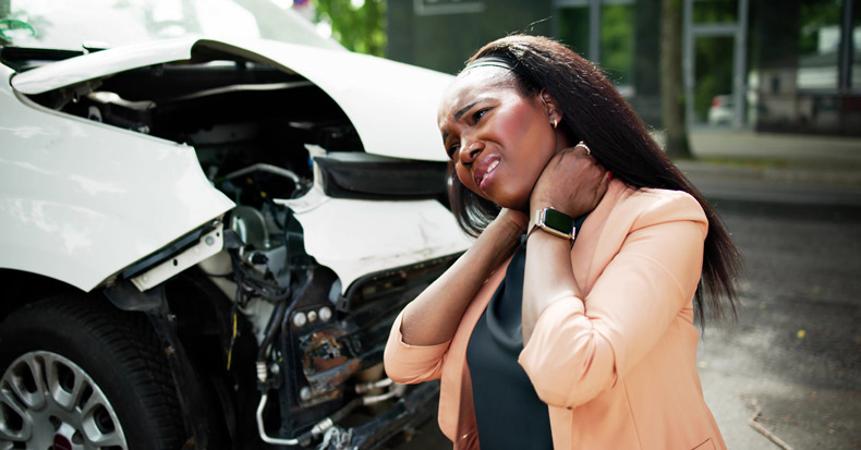 Middle aged woman suffering neck pain after a car accident