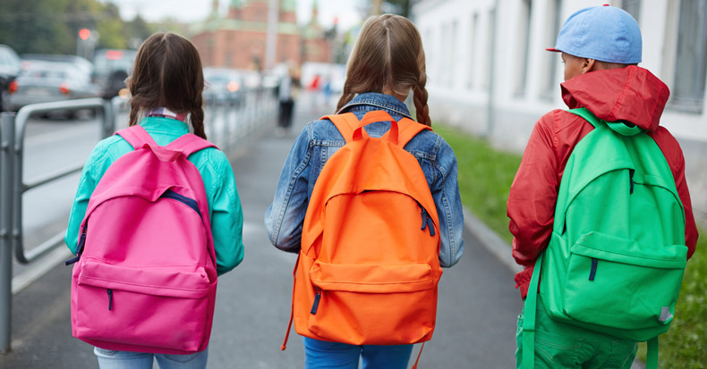 schoolkids carrying backpacks